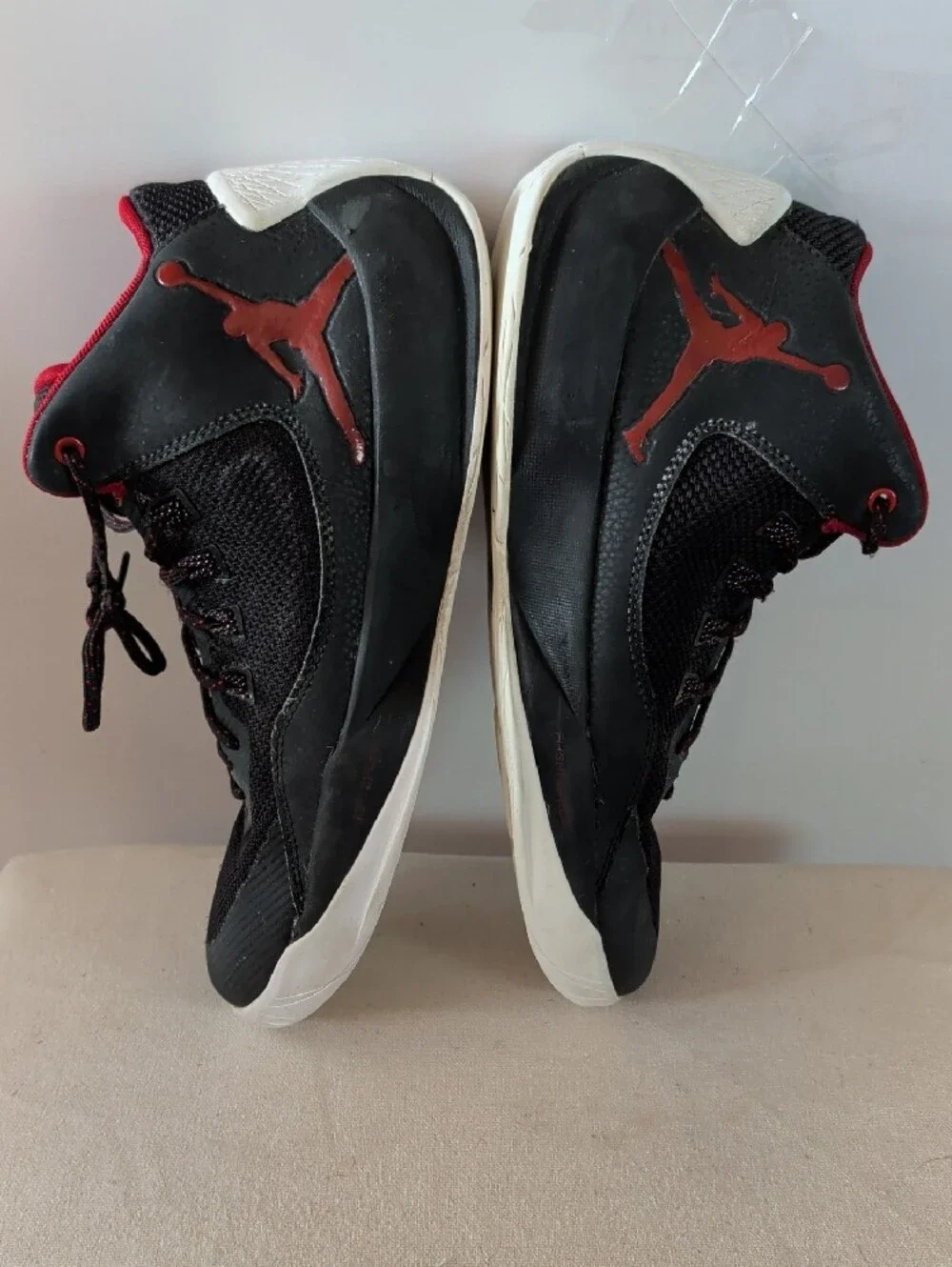Jordan Men’s Black and Red High-Top Athletic Basketball Shoes.